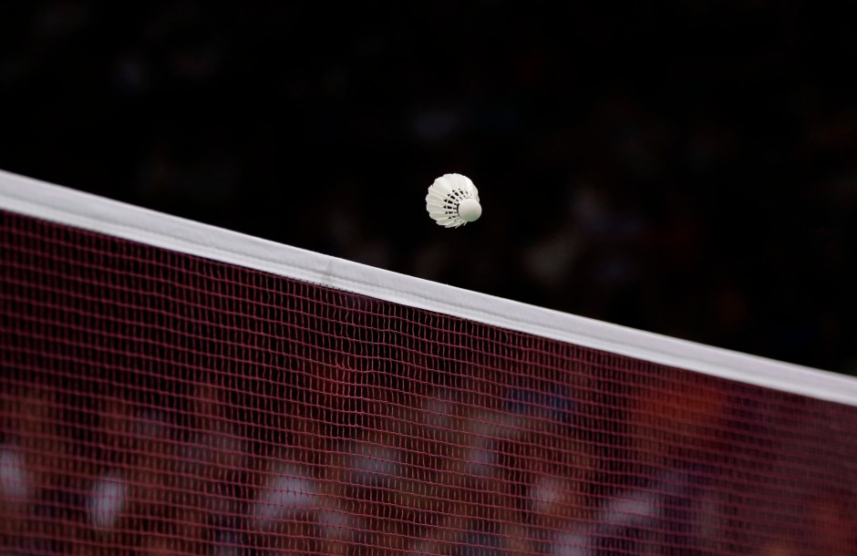 Shuttlecock passing over a net