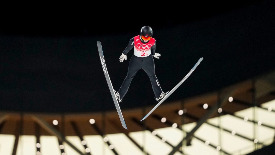 Alexandria Loutitt flies towards the camera while doing a ski jump