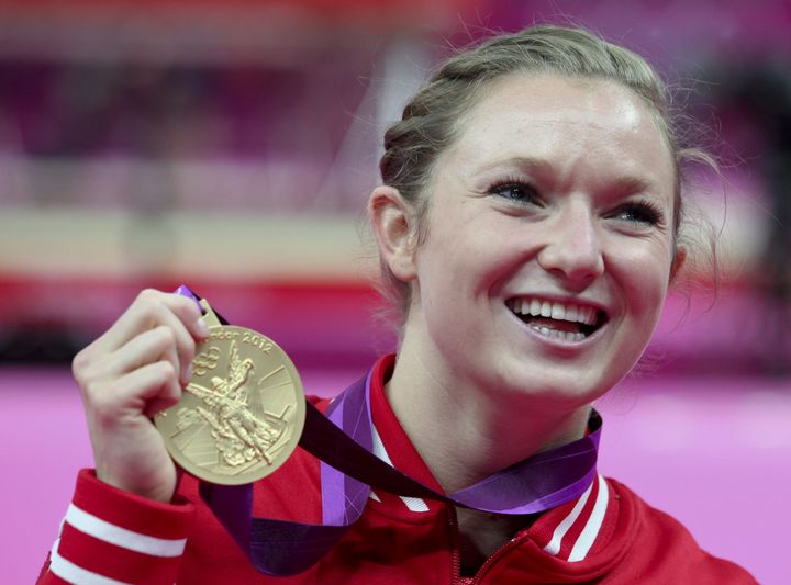 athlete posing with her medal at London 2012